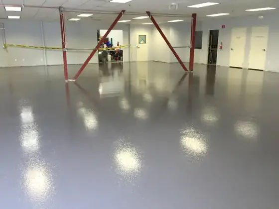 Large commercial shop floor with glossy epoxy coating