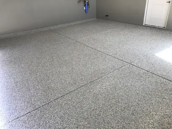 Residential garage with a finished decorative flake epoxy floor