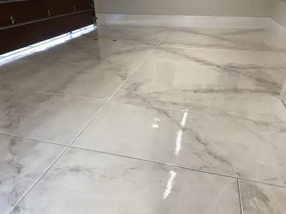 White marble metallic epoxy floor installed by Epoxy Pros